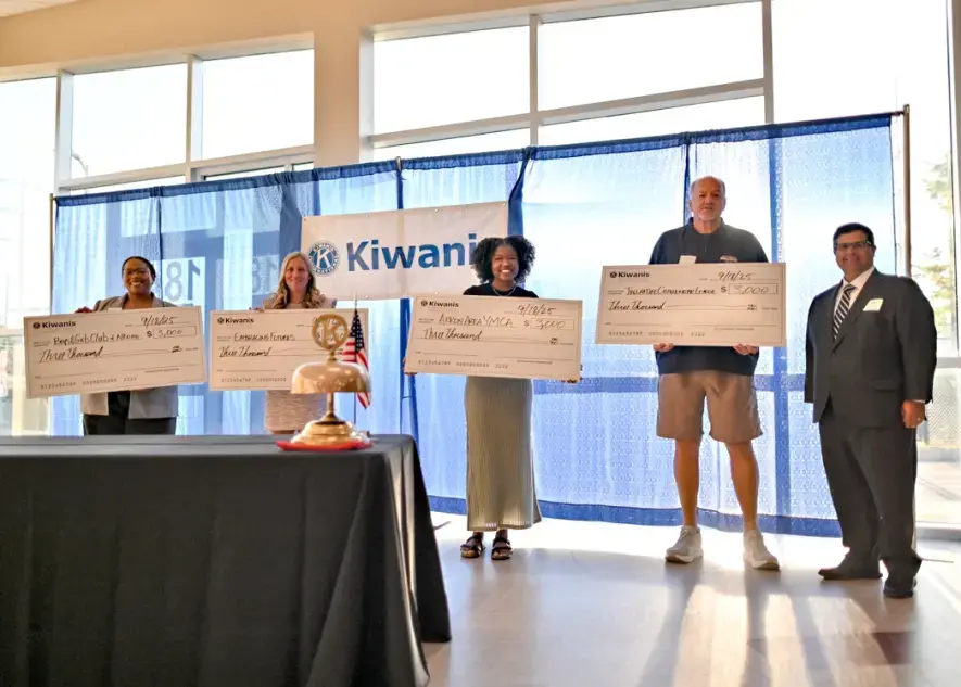Steve Cataliano from W3 Financial poses with our 2025 Kiwanis grant recipients